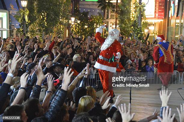 Santa Claus character entertains the crowd during a Christmas tree-lighting ceremony featuring Britney Spears at The LINQ Promenade on November 21,...