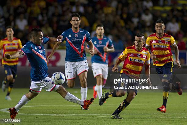 Juan Pablo Rodriguez of Morelia vies for the ball with Fernando Meneses of Veracruz, during their Mexican Apertura 2015 tournament football match, at...