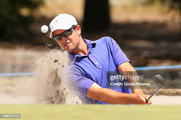 Andrew Evans of Australia plays out of the bunker during the final round of the 2015 Australian Masters at Huntingdale Golf Club on November 22, 2015...