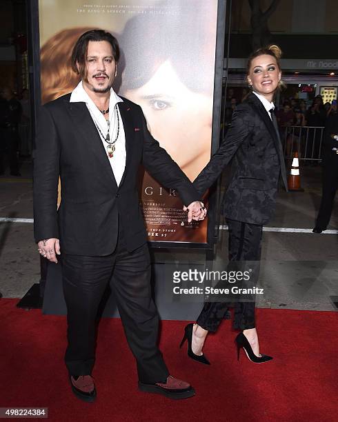 Johnny Depp and Amber Heard arrives at the Premiere Of Focus Features' "The Danish Girl" at Westwood Village Theatre on November 21, 2015 in...