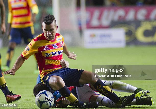 Juan Pablo Rodriguez of Morelia vies for the ball with Rodrigo Noya of Veracruz, during their Mexican Apertura 2015 tournament football match, at the...