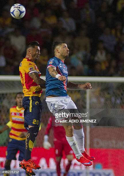 Rodrigo Millar of Morelia vies for the ball with Juan Albin of Veracruz, during their Mexican Apertura 2015 tournament football match, at the Jose...