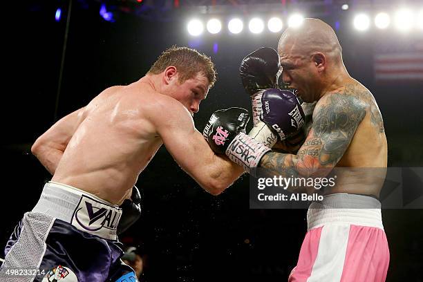 Canelo Alvarez throws a right at Miguel Cotto during their middleweight fight at the Mandalay Bay Events Center on November 21, 2015 in Las Vegas,...