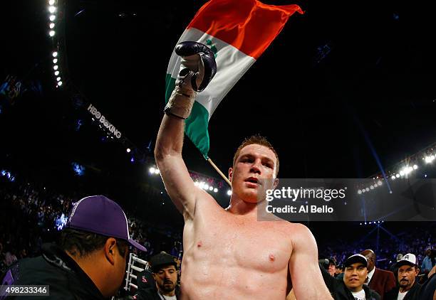 Canelo Alvarez celebrates after defeating Miguel Cotto by unanimous decision in their middleweight fight at the Mandalay Bay Events Center on...