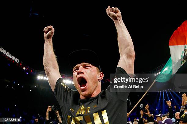 Canelo Alvarez celebrates after defeating Miguel Cotto by unanimous decision in their middleweight fight at the Mandalay Bay Events Center on...