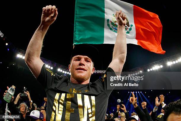 Canelo Alvarez celebrates after defeating Miguel Cotto by unanimous decision in their middleweight fight at the Mandalay Bay Events Center on...