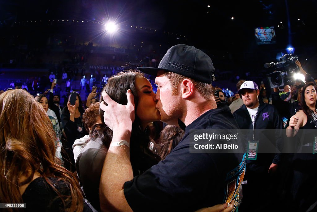 Canelo Alvarez celebrates with Nelda Sepulveda after defeating Miguel