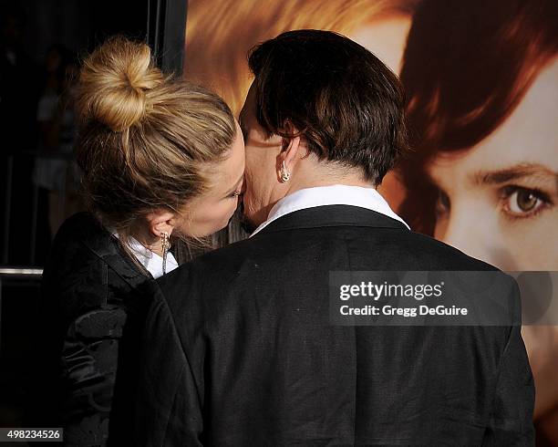 Actors Johnny Depp and Amber Heard arrive at the premiere of Focus Features' "The Danish Girl" at Westwood Village Theatre on November 21, 2015 in...