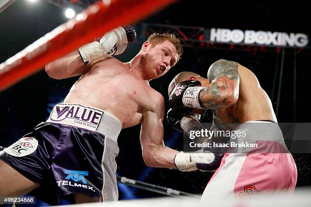 Canelo Alvarez throws a left at Miguel Cotto during their middleweight fight at the Mandalay Bay Events Center on November 21, 2015 in Las Vegas,...