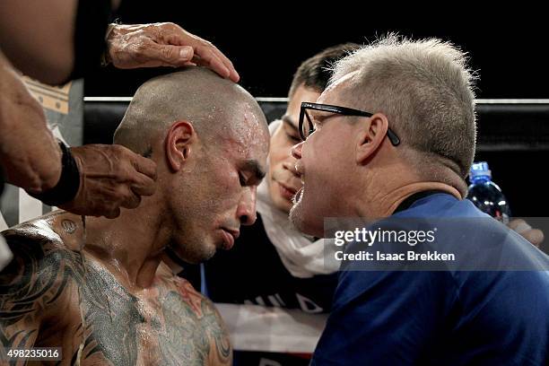 Miguel Cotto talks with trainer Freddie Roach as he takes on Canelo Alvarez during their middleweight fight at the Mandalay Bay Events Center on...