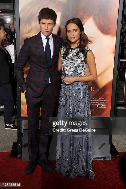 Actors Eddie Redmayne and Alicia Vikander arrive at the premiere of Focus Features' "The Danish Girl" at Westwood Village Theatre on November 21,...