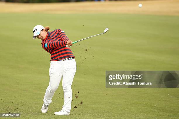 Ai Suzuki of Japan hits her second shot on the 8th hole during the final round of the Daio Paper Elleair Ladies Open 2015 at the Itsuura-teien...