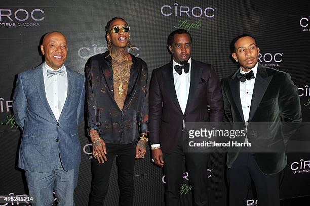 Russell Simmons, Wiz Khalifa, Sean 'Diddy' Combs and Ludacris arrive at Sean 'Diddy' Combs Exclusive Birthday Celebration on November 21, 2015 in...