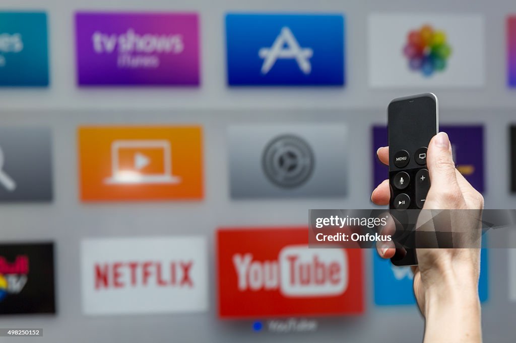 Human Hand Holding The New Apple Tv Siri Remote