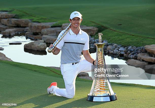 Rory McIlroy of Northern Ireland poses with The DP World Tour Championship and the Race to Dubai trophy after his one shot win in the final round of...