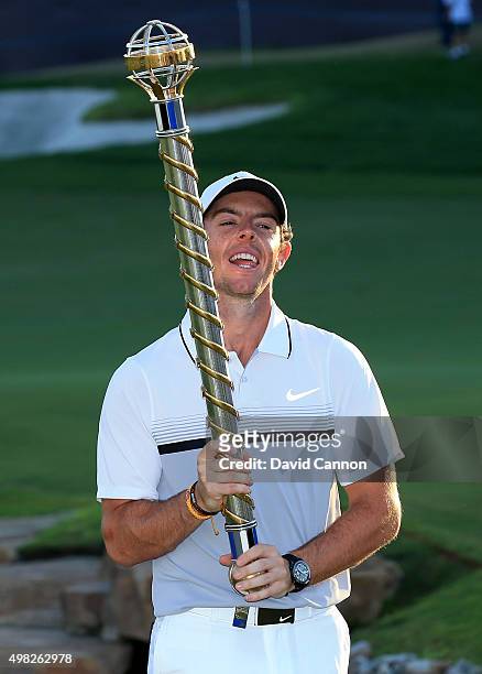 Rory McIlroy of Northern Ireland poses with the DP World Tour Championship after his one shot win in the final round of the 2015 DP World Tour...