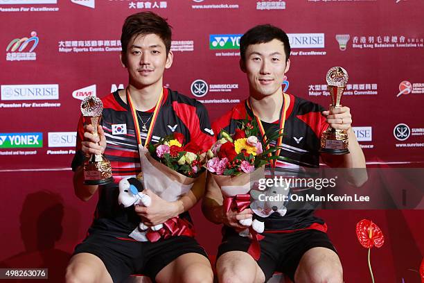 Lee Yong Dae and Yoo Yeon-Seong pose for a picture with their medals after the match between Yoo Yeon Seong and Lee Yong Dae of Korea and Mathias Boe...