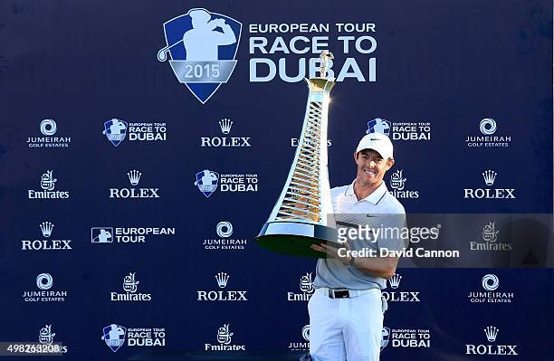 Rory McIlroy of Northern Ireland poses with the Race to Dubai trophy after his one shot win in the final round of the 2015 DP World Tour Championship...