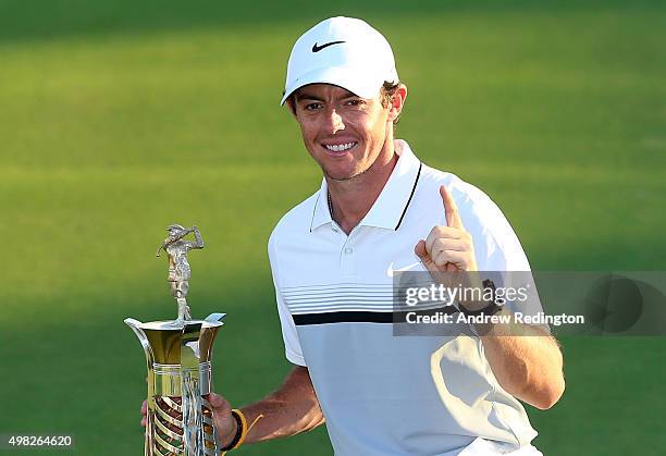 Rory McIlroy of Northern Ireland Rory McIlroy of Northern Ireland poses with the Race To Dubai trophy following the final round of the DP World Tour...