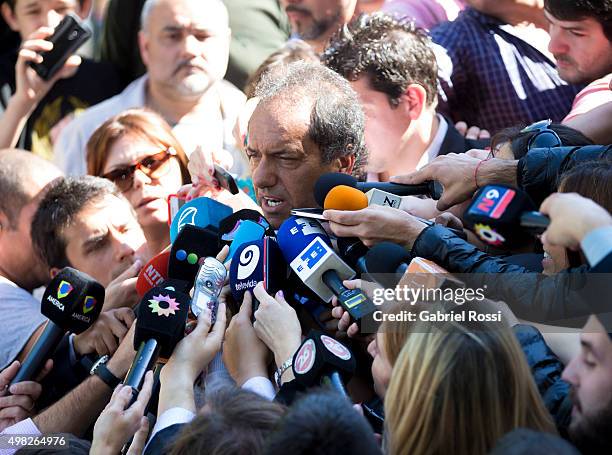 Daniel Scioli Presidential Candidate for Frente Para La Victoria talks to the press before casting his vote during runoff elections on November 22,...