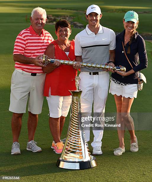 Rory McIlroy of Northern Ireland poses with his father Gerry McIlroy, his mother Rosie McIlroy, his girlfriend Erica Stoll and the DP World Tour...