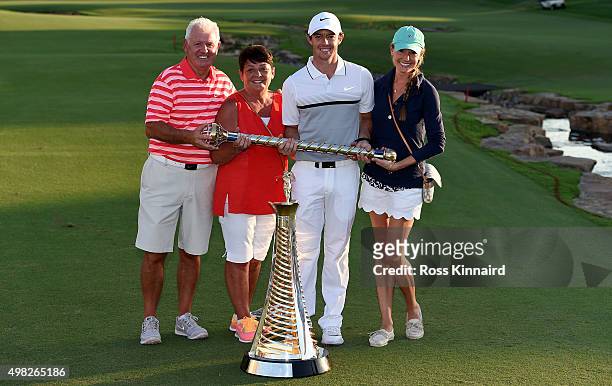 Rory McIlroy of Northern Ireland poses with his father Gerry McIlroy, his mother Rosie McIlroy, his girlfriend Erica Stoll and the DP World Tour...