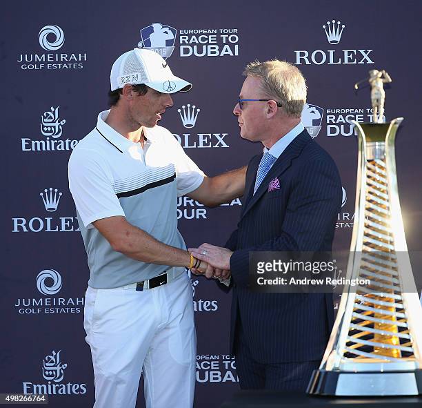 Rory McIlroy of Northern Ireland and Keith Pelley, Chief Executive of The European Tour, are pictured together with the Race To Dubai trophy...