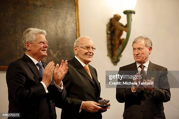 Former German President Roman Herzog C) receives the Award from German president Joachim Gauck and former German president Horst Koehler during the...