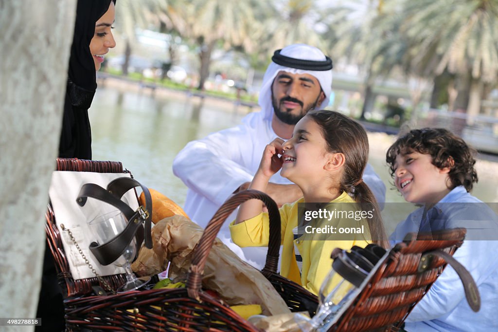 Arab family enjoying their leisure time in picnic