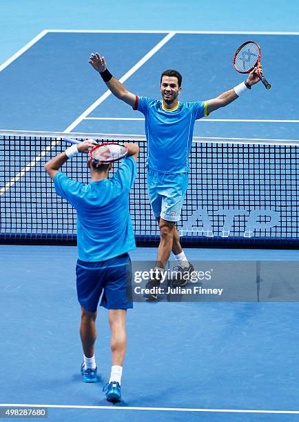 Horia Tecau of Romania and Jean-Julien Rojer of France celebrate victory during the men's doubles final against Rohan Bopanna of India and Florin...