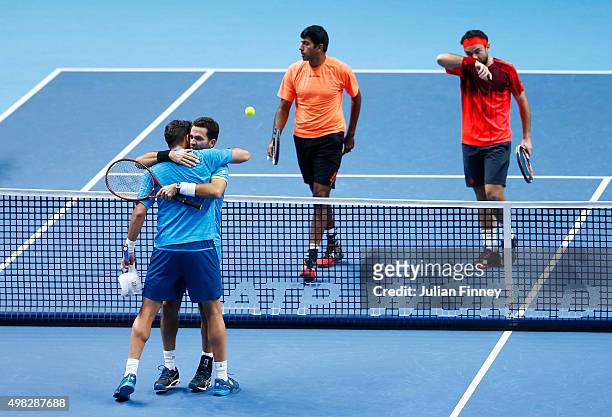 Horia Tecau of Romania and Jean-Julien Rojer of France celebrate victory during the men's doubles final against Rohan Bopanna of India and Florin...