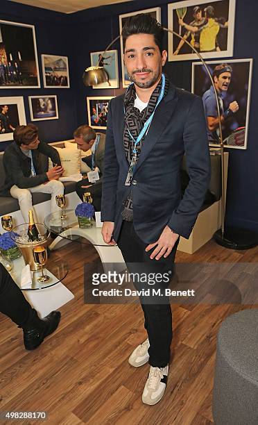Michael Russo celebrates with Moet & Chandon whilst raising a toast to the winners of the 2015 Barclays ATP World Tour Finals at The O2 Arena on...