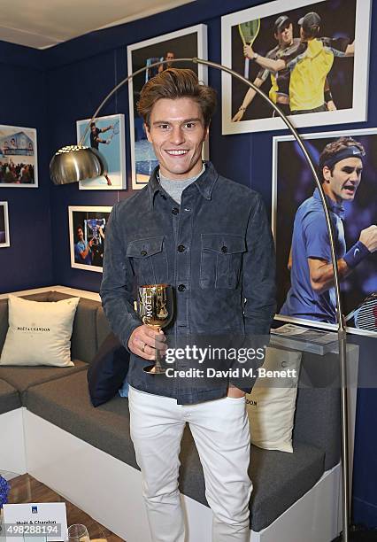 Oliver Cheshire celebrates with Moet & Chandon whilst raising a toast to the winners of the 2015 Barclays ATP World Tour Finals at The O2 Arena on...