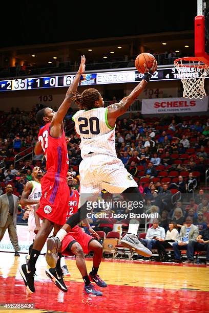 Cartier Martin of the Iowa Energy looks drives to the basket against Sam Thompson of the Grand Rapids Drive in an NBA D-League game on November 21,...