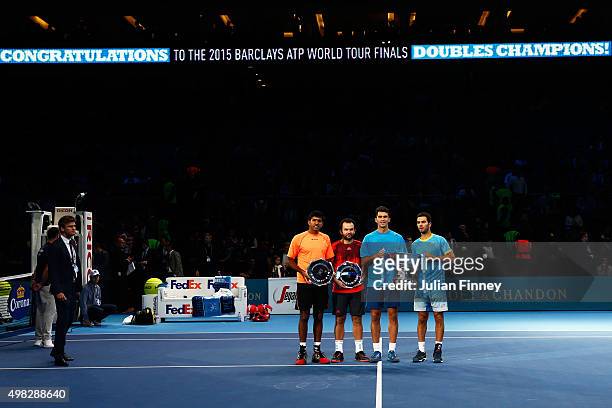 Runners up Rohan Bopanna of India and Florin Mergea of Romania pose alongside the winners, Horia Tecau of Romania and Jean-Julien Rojer of France...