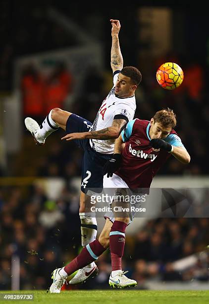 Kyle Walker of Tottenham Hotspur challenges for the ball with Nikica Jelavic of West Ham United during the Barclays Premier League match between...