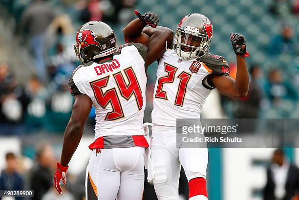 Lavonte David and Alterraun Verner of the Tampa Bay Buccaneers show camaraderie before playing against the Philadelphia Eagles at Lincoln Financial...