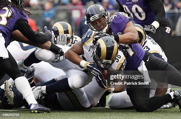 Running back Todd Gurley of the St. Louis Rams score a first quarter touchdown past inside linebacker Daryl Smith of the Baltimore Ravens at M&T Bank...