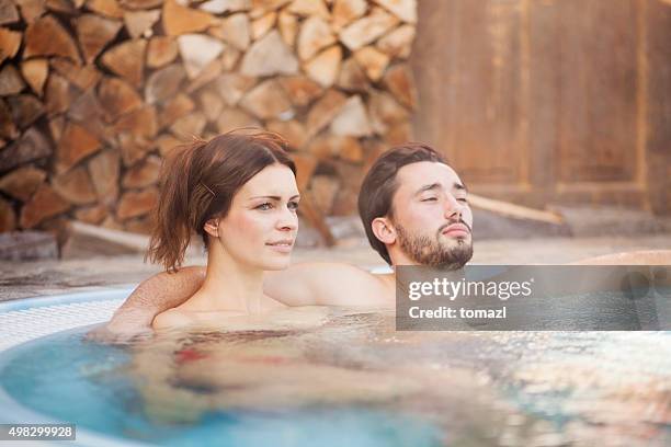 couple enjoying in a hot tub - whirlpool bildbanksfoton och bilder