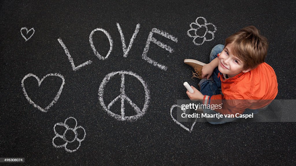 Cute Boy, with Chalk on Street/Tarmac, Love Peace Flowers Happin