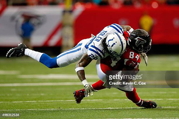 Roddy White of the Atlanta Falcons makes a reception against Greg Toler of the Indianapolis Colts during the first half at the Georgia Dome on...
