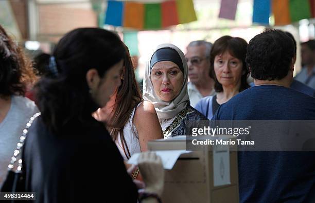 Voters wait to cast their ballots at a polling station on November 22, 2015 in Buenos Aires, Argentina. Argentina is facing its first presidential...