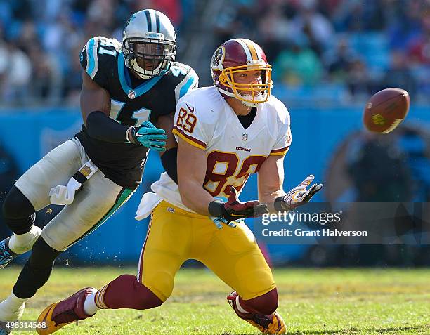 Roman Harper of the Carolina Panthers defends a pass to Derek Carrier of the Washington Redskins during their game at Bank of America Stadium on...