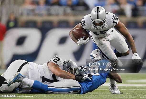 Michael Crabtree of the Oakland Raiders tires to avoid the tackle by Dwight Bentley of the Detroit Lions in the second quarter at Ford Field on...