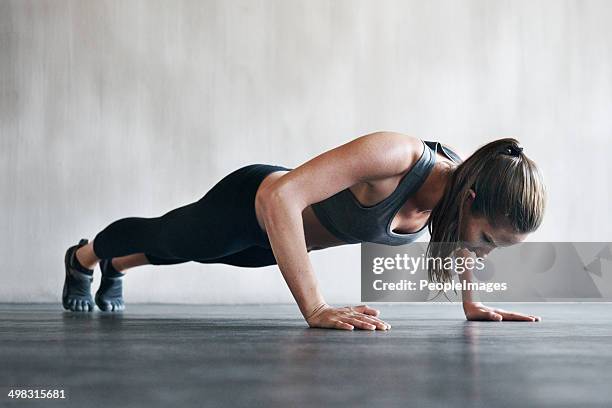 feeling good, looking great from working out regularly - press ups stock pictures, royalty-free photos & images