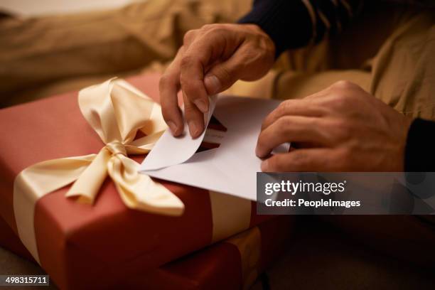 spreading the joy - handing gift card stock pictures, royalty-free photos & images