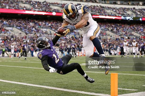 Tight end Lance Kendricks of the St. Louis Rams scores a third quarter touchdown past cornerback Jimmy Smith of the Baltimore Ravens at M&T Bank...