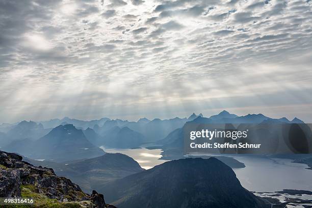 clouds over lofoten landscape, norway - sonnenstrahlen stock pictures, royalty-free photos & images