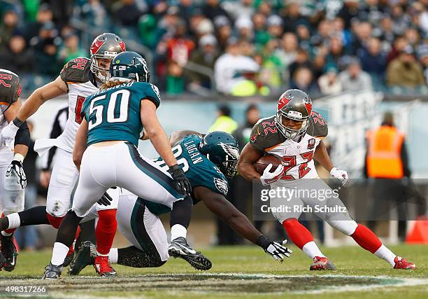 Doug Martin of the Tampa Bay Buccaneers runs the ball against Bennie Logan of the Philadelphia Eagles in the third quarter at Lincoln Financial Field...