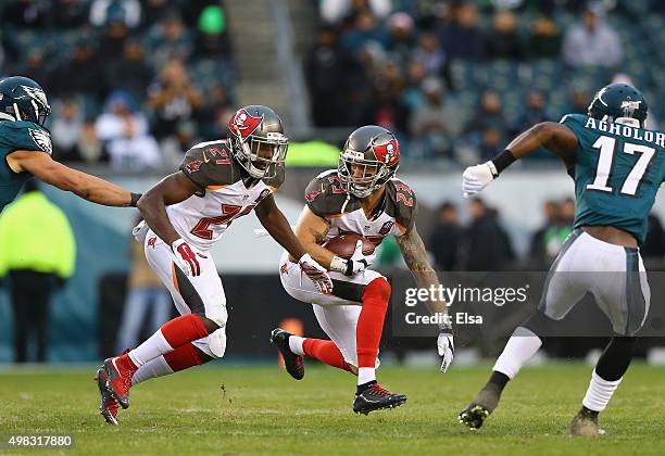 Chris Conte of the Tampa Bay Buccaneers carries a pass he intercepted from quarterback Mark Sanchez of the Philadelphia Eagles in the fourth quarter...